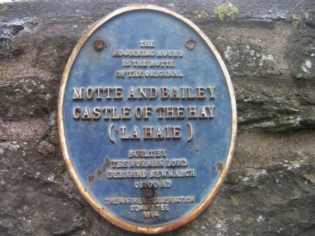 HayMotte1 "The adjoining mound is the original motte of the Motte and Bailey Castle of the Hay (La Haie) built by the Norman lord Bernard Newmarch c1100 AD."