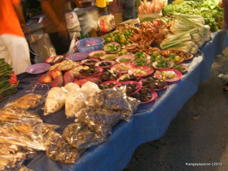 various wares including bags of snails and unknown seed pods