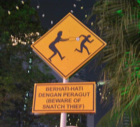 purse snatching warning sign