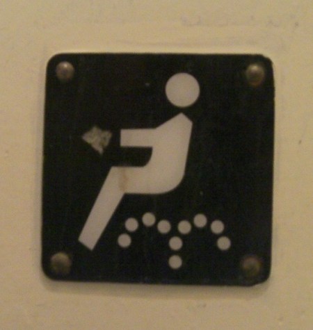 Bidet Warning sitting human figure above two dotted arched lines