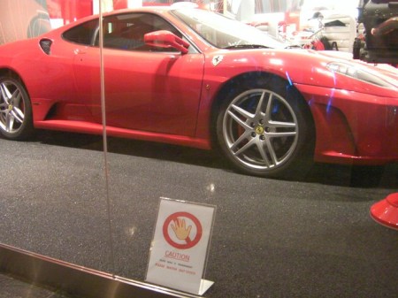 Glass wall sports car in mall display window