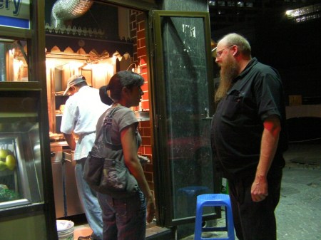 Shawarma people standing at a shawarma stand