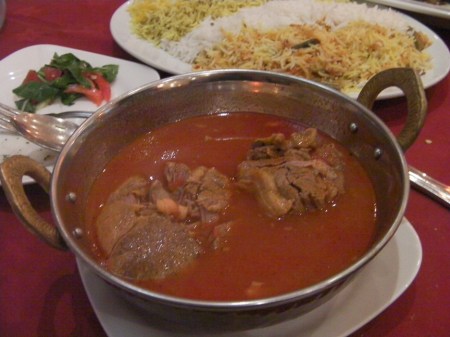 Clay pot lamb bowl of lamb in a red stew