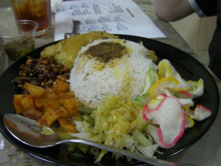 Nasi padang plate of rice, chicken, vegetables, etc.