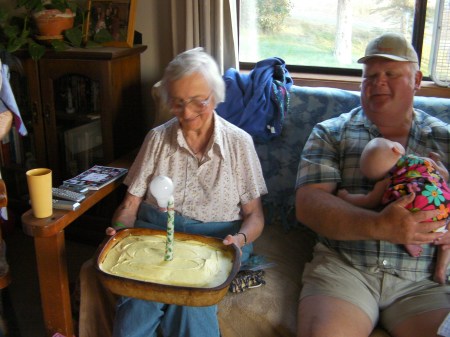 Mom's birthday cake with a taper candle with a lightbulb attached to it