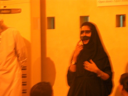 woman modeling a face guard called a burka