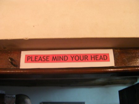 Please Mind Your Head sign stating "please mind your head"