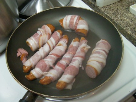 Bacon sausage 1 frying pan full of sausage wrapped in bacon