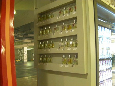 Perfume Vending Machine 3 Sample bottles attached to the side of the perfume vending machine