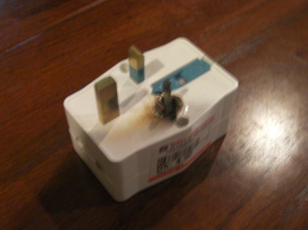 electrical adapter with burnt plug