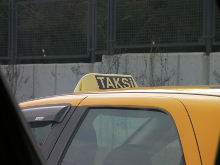 Taksi yellow taxi cab with sign that says taksi