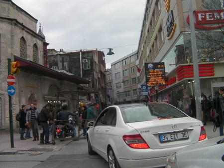 man blocking traffic with a wheeled rack
