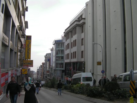 street view with a textile shop five stories tall
