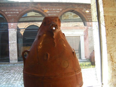 large clay pot with an animal head and mouth spout
