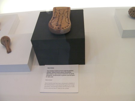 clay game board similar to a cribbage board