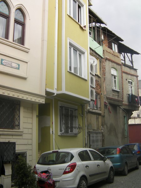 cobble stone street with narrow multistory houses