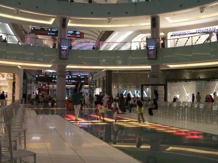 kids running and playing on the lighted mall floor