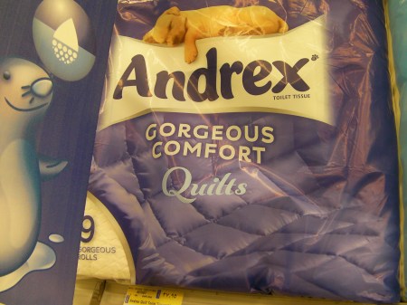 toilet paper package stating "gorgeous comfort quilts"