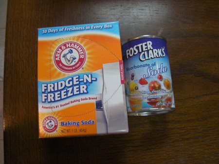 box of baking soda and a small can of baking soda