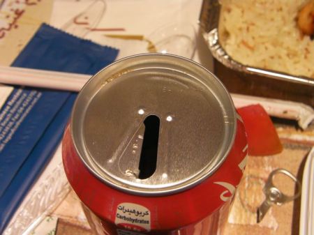 only half of the tab pulled of the coke can