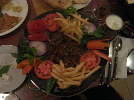 Lamb plate of lamb meat, fries and vegetables