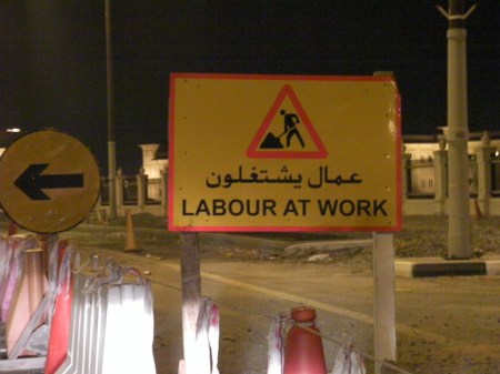 caution sign stating "labour at work"