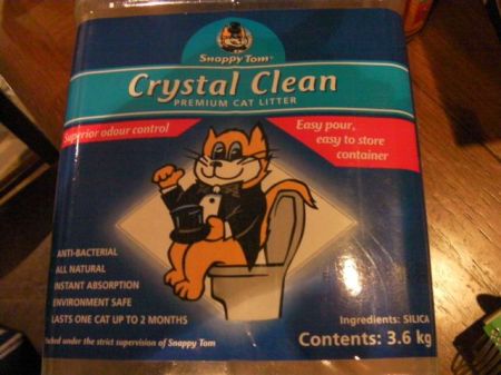 cartoon cat in a tux sitting on a toilet