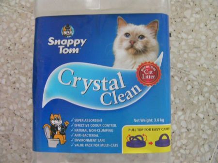 cartoon cat in tux on toilet is now small image in corner of label