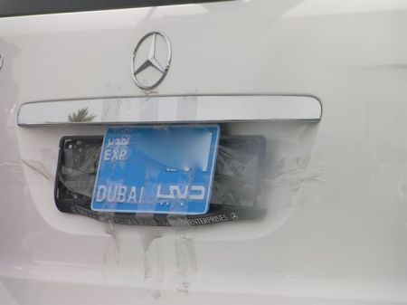 Taped License Plate car license plate taped onto the car