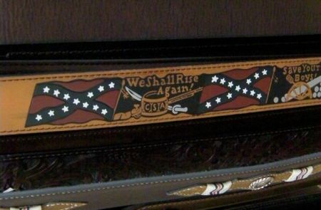 leather belt with the Confederate flag and the words we shall rise again