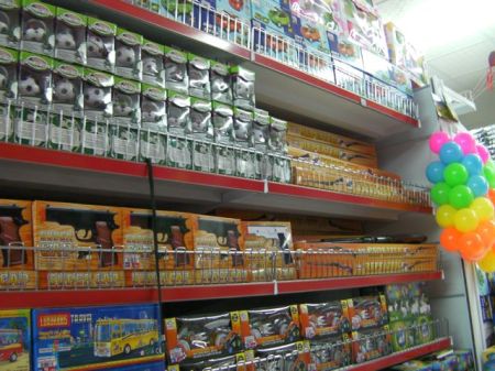 store shelf full of realistic hand guns