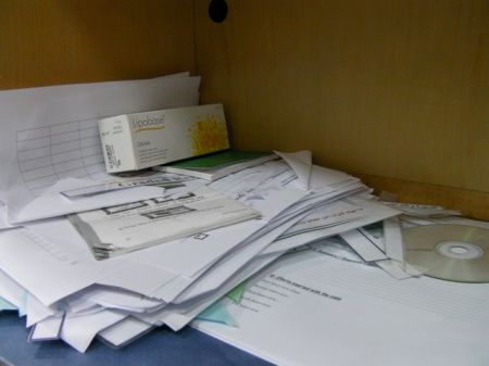 Messy Desk pile of papers