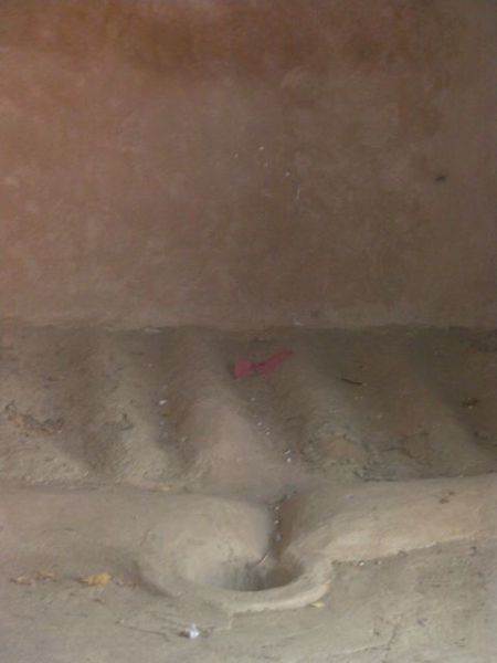 sloped depressions in the floor leading to a drain