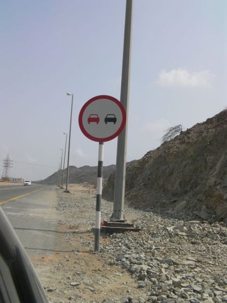 Red Car Black Car road sign with one red car and one black car