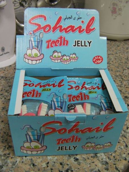 blue box of candy with cartoon teeth on it