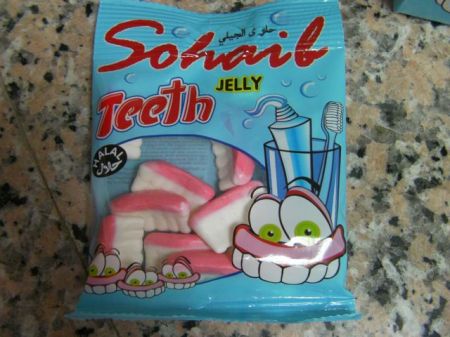 individual bag of soft candies shaped like teeth and gums