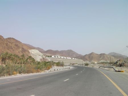 Wadi Al Helo distant view of an artificial plateau topped with white houses