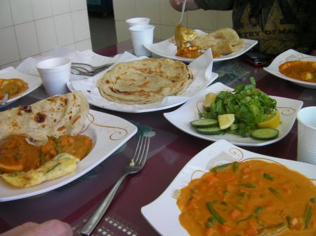 plates and bowls of Indian food