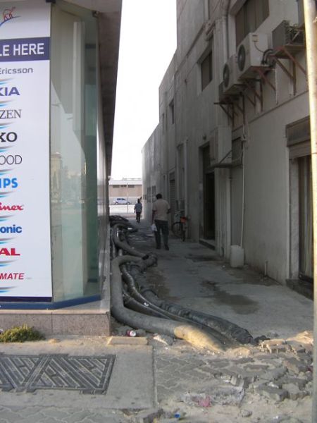 Alley alley way with large temporary pipes