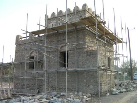 Bithnah Fort 4 stone building covered in scaffolding