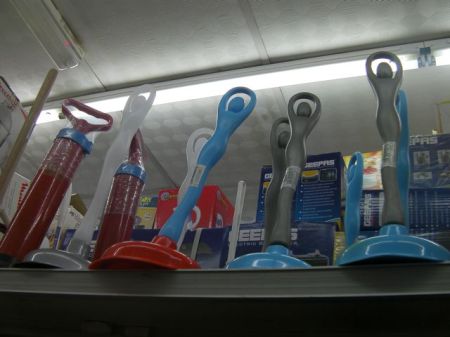 plungers with handles shaped like women