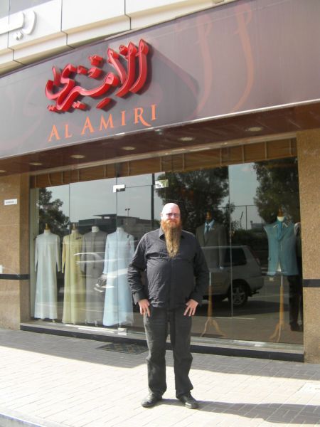 Tailor Shop man in front of a tailor shop