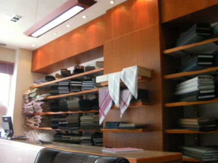 Tailor Shop Interior shelves full of fabric