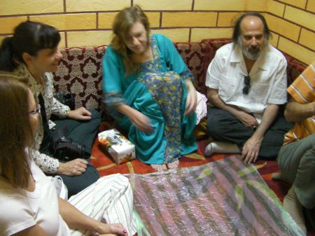 people sitting on a carpeted eating area