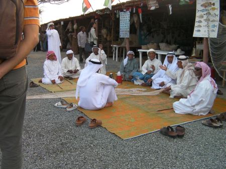 fishermen making nets by hand