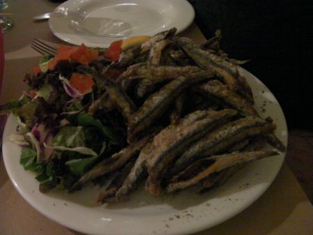 tiny fried fish and green salad