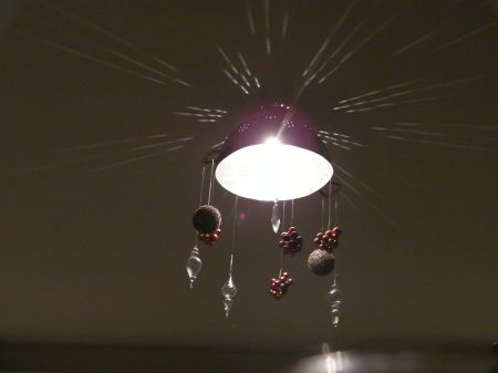ceiling light fixture made of an upside down colander  