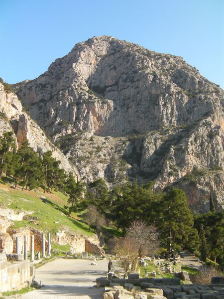 Greek ruins with an imposing mountain behind