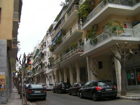 Athens Neighborhood narrow street bordered by 5 story apartment buildings