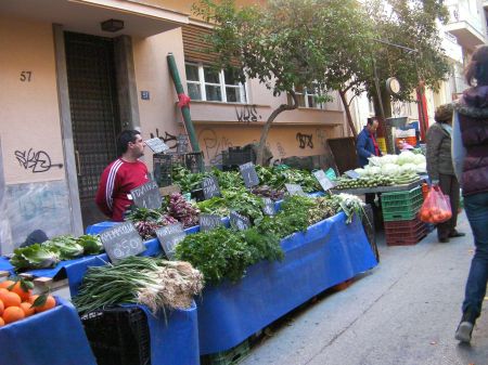 street lined with tables full of vegetables for sale